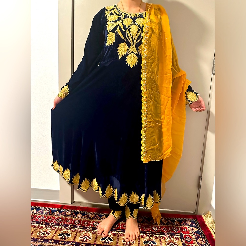 This beautiful mediums size  dress blue and gold in color with no defects